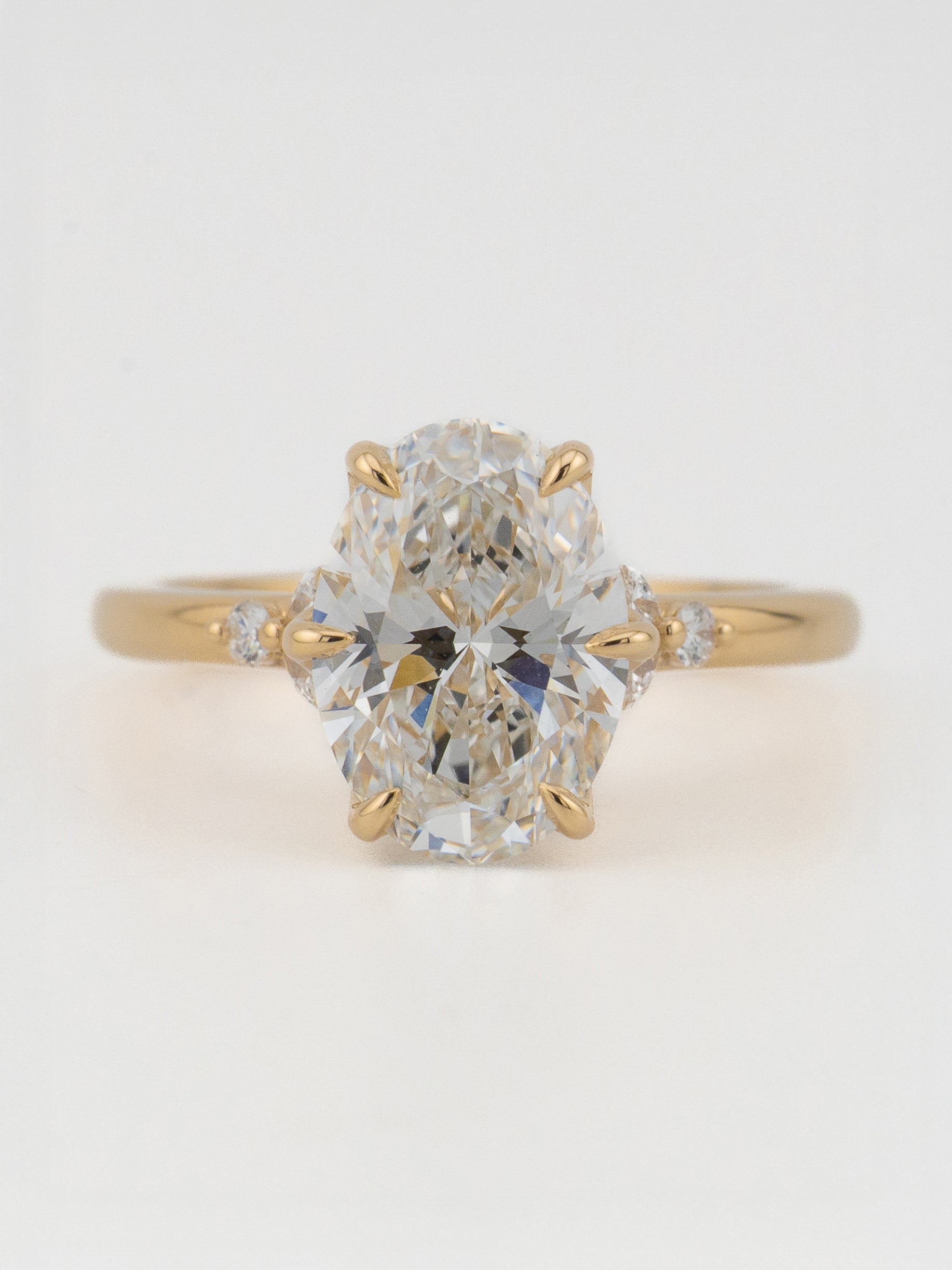 Top-down view of clean solitaire with oval diamond